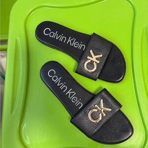 Calvin Klein Black and Gold Slides